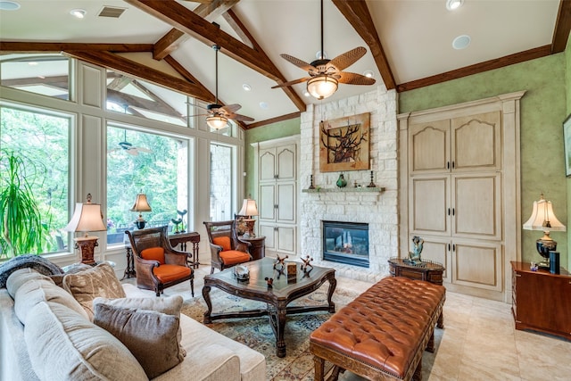 living room featuring ceiling fan, beam ceiling, high vaulted ceiling, a stone fireplace, and light tile patterned flooring