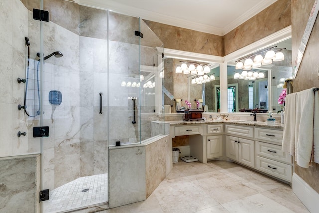 bathroom with vanity, an inviting chandelier, a shower with shower door, and crown molding