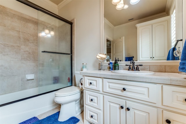 full bathroom with vanity, toilet, ornamental molding, and bath / shower combo with glass door