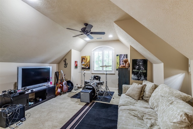 carpeted living room with ceiling fan, lofted ceiling, and a textured ceiling