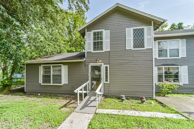 view of front of property with a front lawn