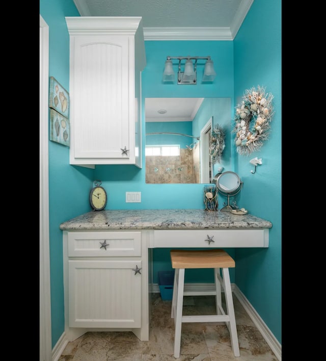 bathroom with vanity, tile patterned floors, and crown molding