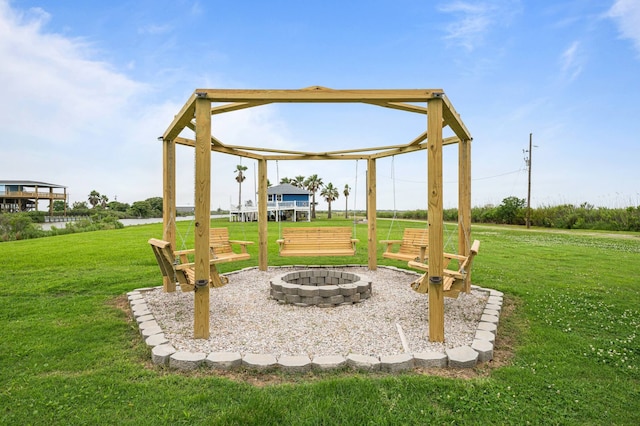 view of yard with a fire pit