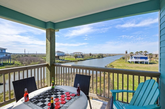 exterior space featuring a water view and a lawn