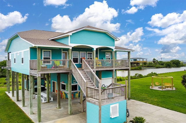 view of front of home with a water view and a front yard