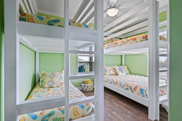 bedroom featuring crown molding, ceiling fan, and wood-type flooring