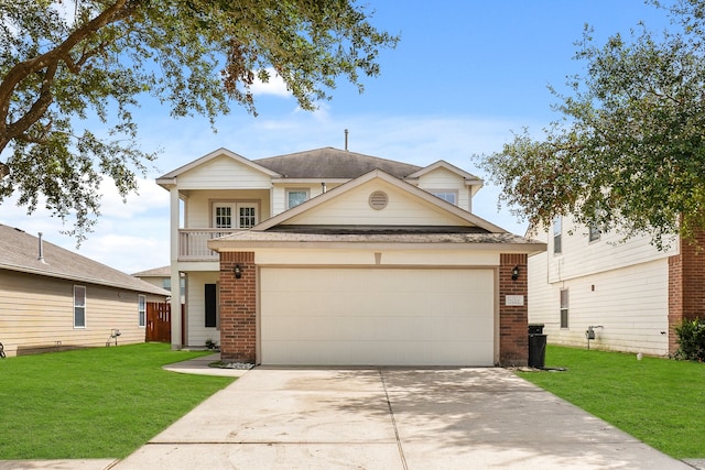 view of front of house featuring a garage, a front yard, and a balcony