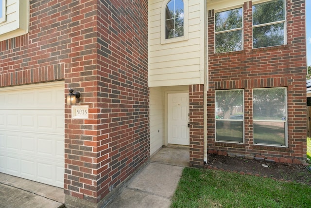 doorway to property featuring a garage