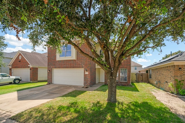 view of front of house with a garage and a front yard