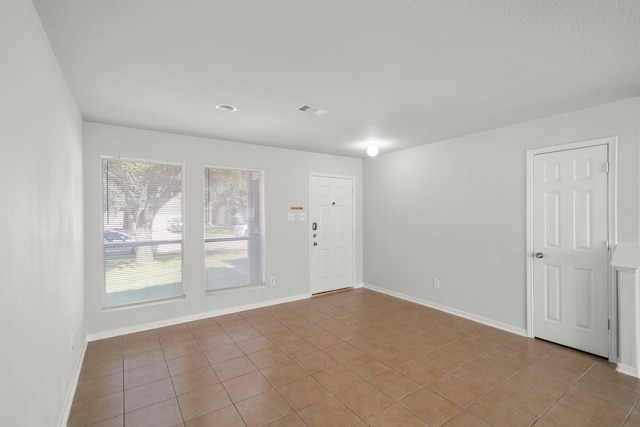 view of tiled spare room