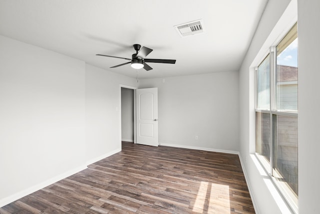 spare room with hardwood / wood-style flooring and ceiling fan