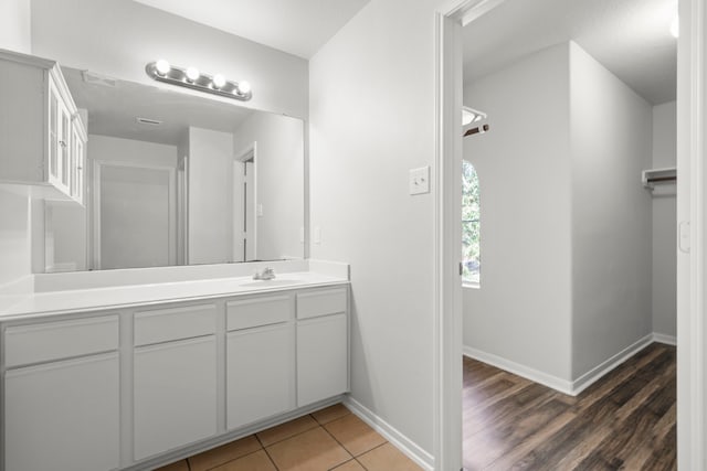 bathroom featuring vanity and wood-type flooring