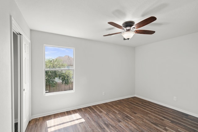 empty room featuring wood-type flooring and ceiling fan