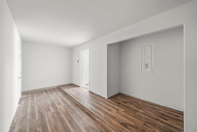 empty room featuring wood-type flooring