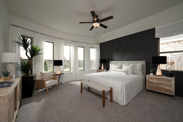 bedroom with carpet, ceiling fan, and multiple windows