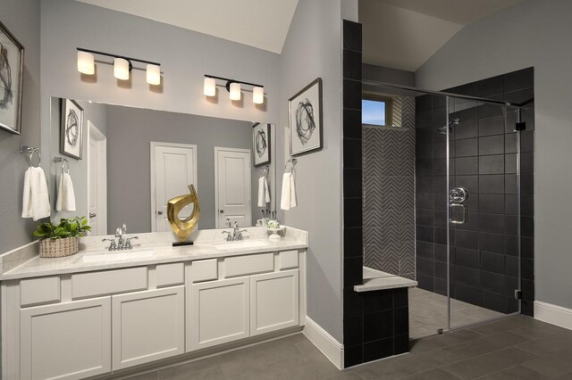 bathroom featuring vanity, vaulted ceiling, and a tile shower