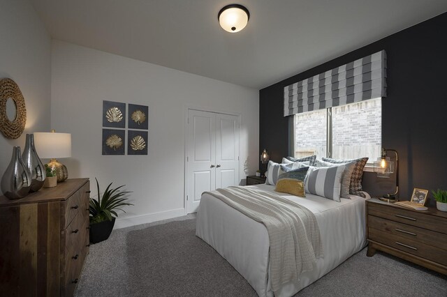 bedroom with carpet and a closet