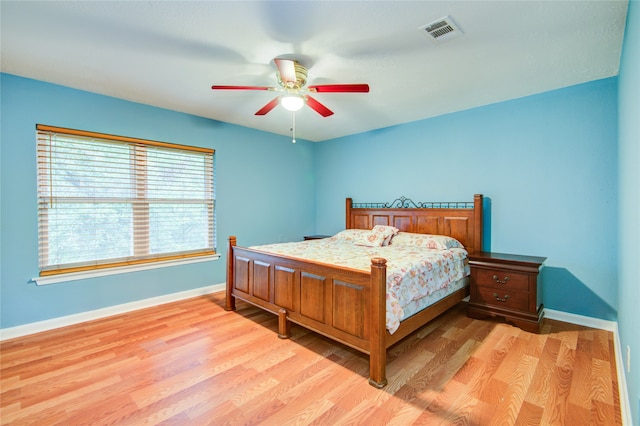 bedroom featuring light wood-type flooring and ceiling fan