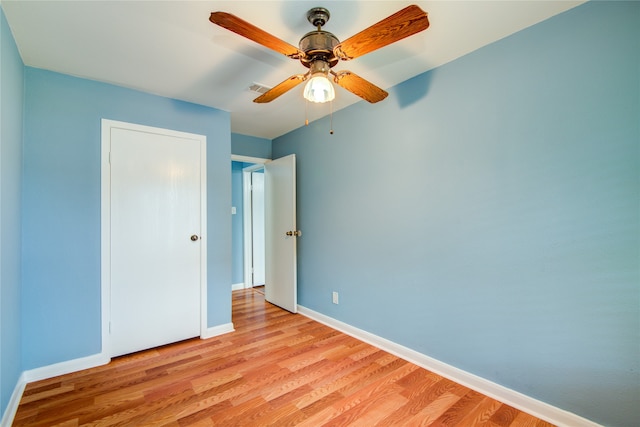 unfurnished bedroom with light wood-type flooring and ceiling fan