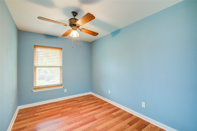 empty room featuring ceiling fan and light hardwood / wood-style floors