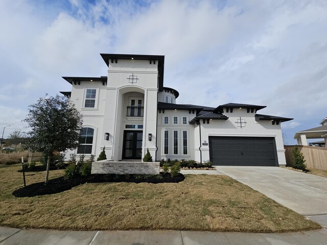 view of front of property featuring a front yard and french doors