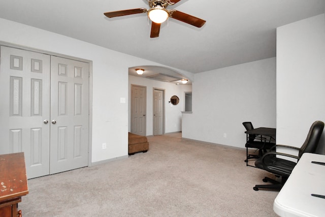 carpeted office featuring ceiling fan