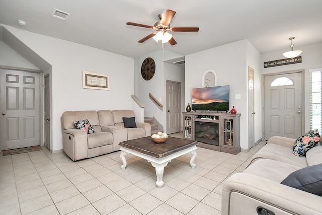 living room with light tile patterned floors and ceiling fan