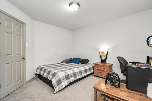 bedroom featuring light colored carpet