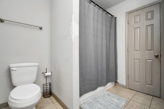 bathroom featuring toilet and tile patterned floors