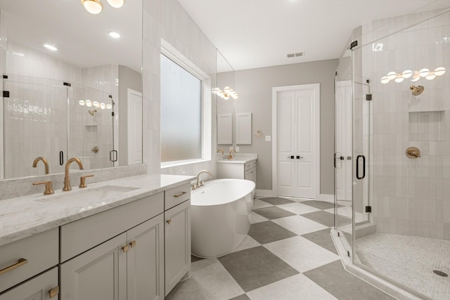 bathroom with separate shower and tub and vanity