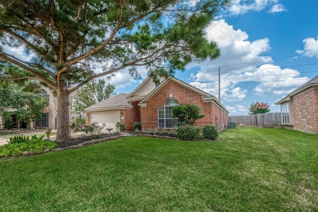 view of front facade with a garage and a front lawn