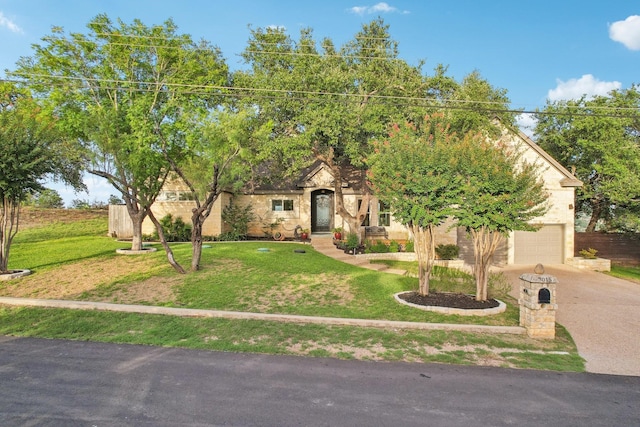 obstructed view of property featuring a garage, stone siding, concrete driveway, and a front lawn