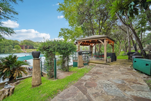 exterior space featuring a water view and a gazebo