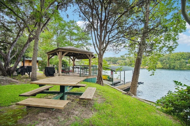 exterior space featuring a yard and a water view