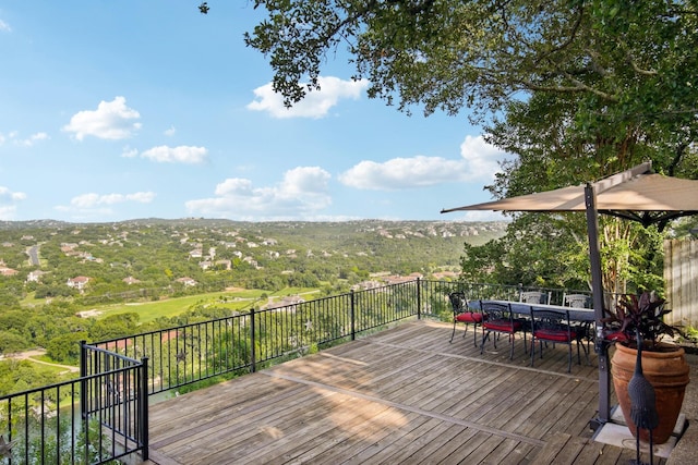 wooden terrace featuring outdoor dining space