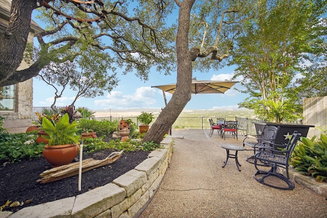 exterior space featuring outdoor dining space, a patio area, and a fenced backyard