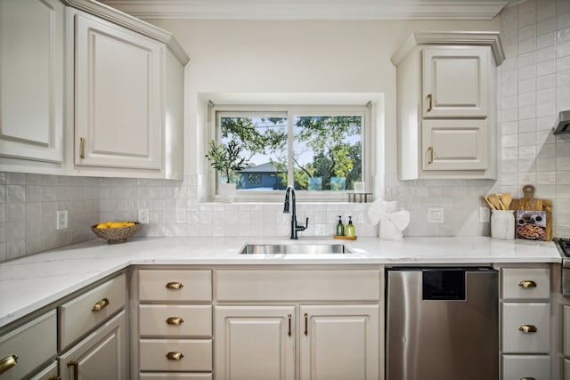 kitchen featuring tasteful backsplash, light stone counters, white cabinetry, sink, and dishwasher