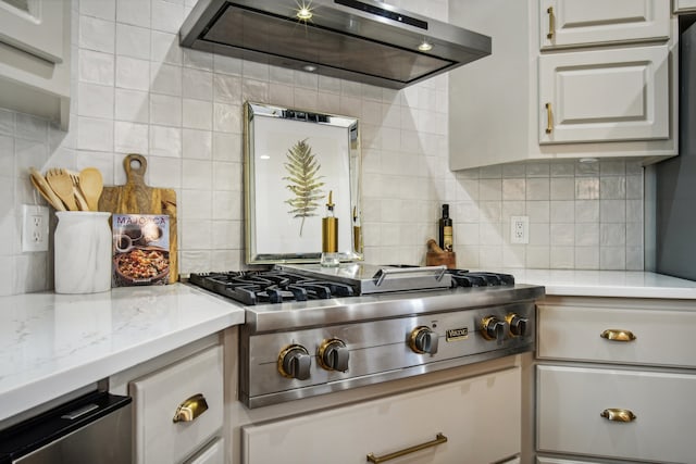 kitchen featuring tasteful backsplash, ventilation hood, light stone countertops, and stainless steel gas stovetop