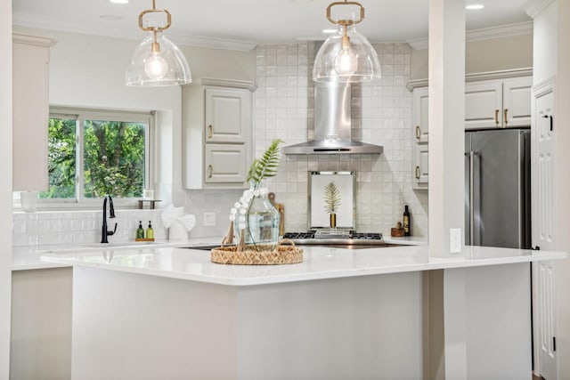 kitchen with stainless steel appliances, crown molding, and light countertops