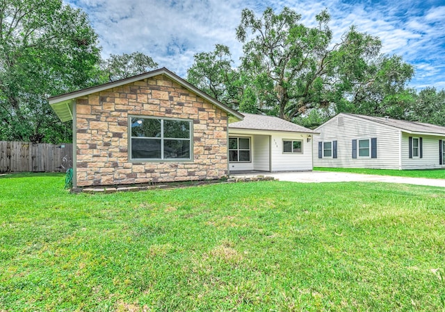 ranch-style home with a patio area and a front yard