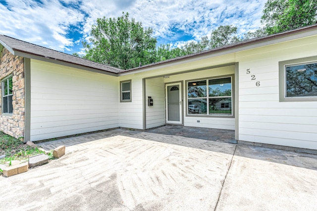 doorway to property featuring a patio area