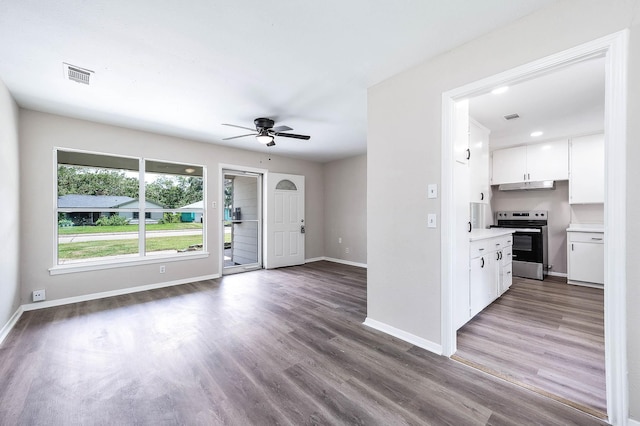 interior space with ceiling fan and hardwood / wood-style floors