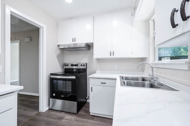 kitchen with sink, dark hardwood / wood-style flooring, electric range, and white cabinets