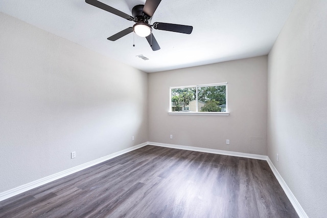 empty room with wood-type flooring and ceiling fan