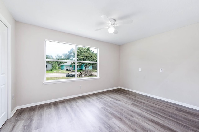 unfurnished room featuring wood-type flooring and ceiling fan