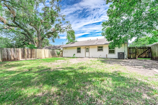 back of property featuring a yard