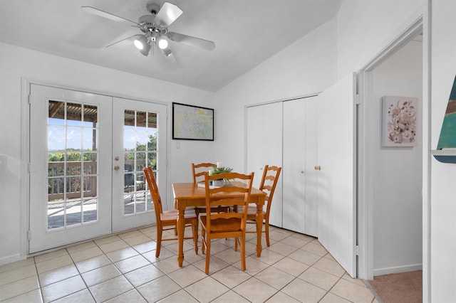 dining room with ceiling fan, lofted ceiling, light tile patterned floors, and french doors