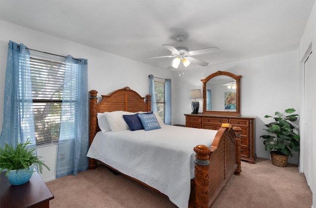 carpeted bedroom featuring ceiling fan