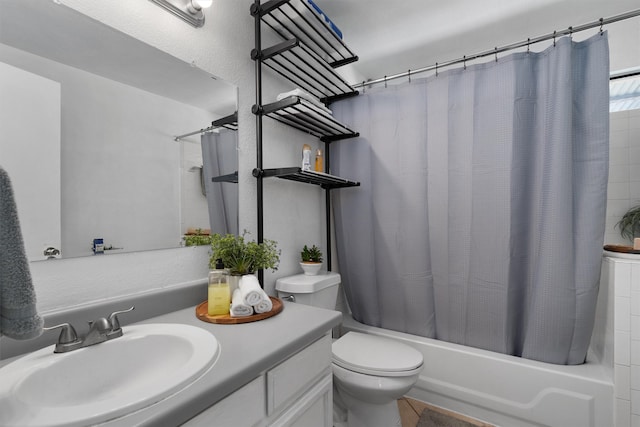 full bathroom with tile patterned flooring, shower / bath combination with curtain, toilet, and vanity