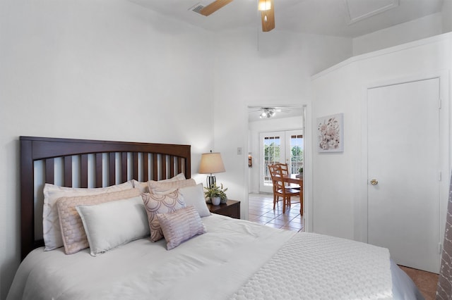 tiled bedroom with ceiling fan